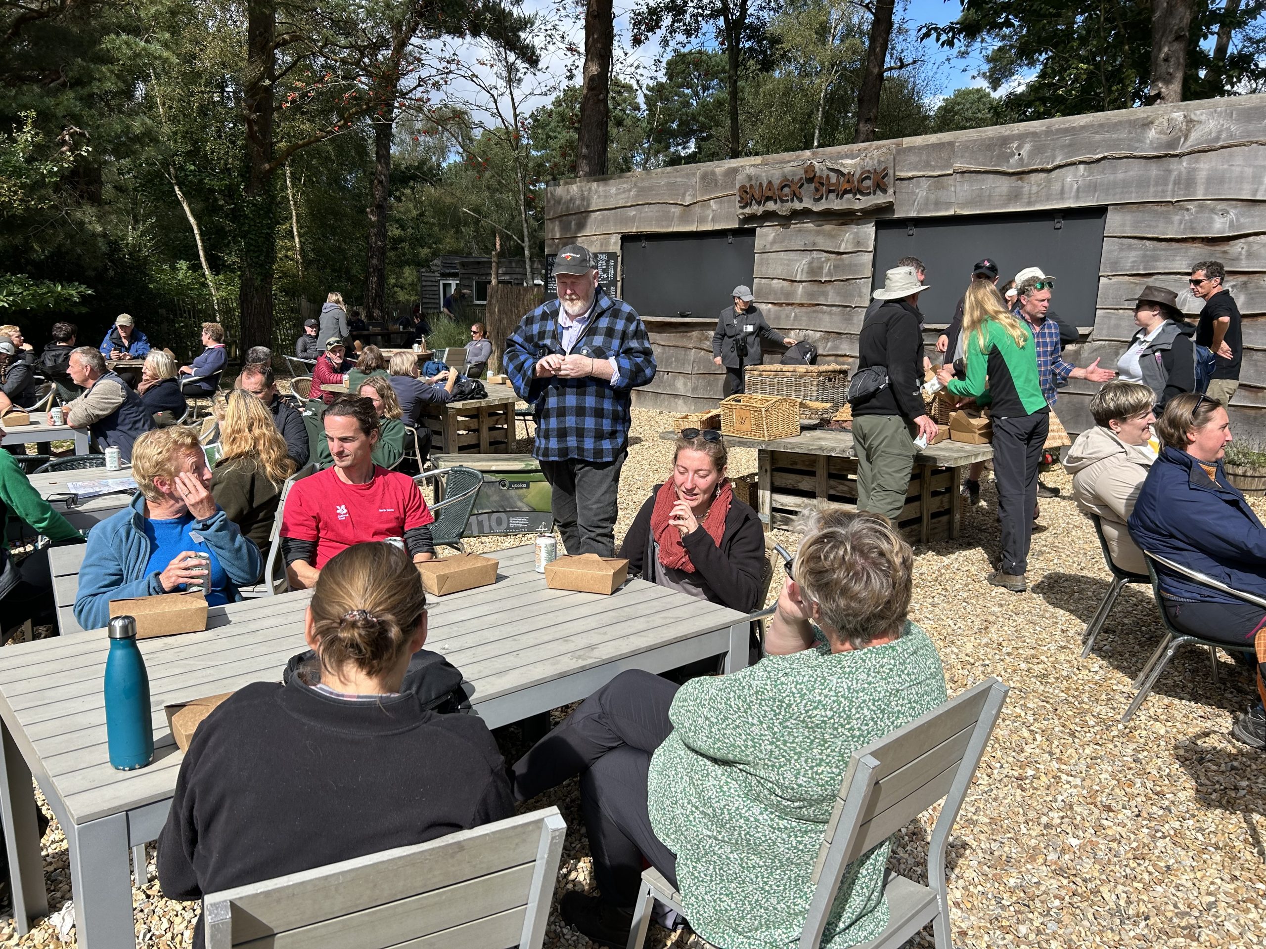 People at a campsite lunch stop
